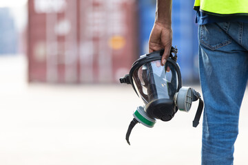 Officials from the Department of Hazardous substances control bureau is investigating the leak of a hazardous chemical at wearhouse container yard. African american or black people.