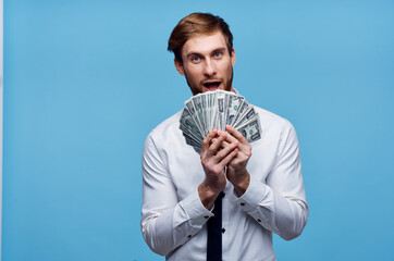 Cheerful man with bundles of money wealth emotion joy