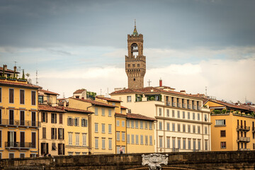 Wall Mural - Florence cityscape with the Santa Trinita Bridge (XVI century) over the River Arno and the clock tower of Palazzo Vecchio (1299) called Torre di Arnolfo, UNESCO world heritage site, Tuscany, Italy.