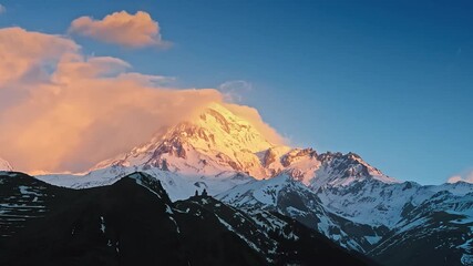 Wall Mural - Hyperlapse of morning sunrise on Kazbek mountain