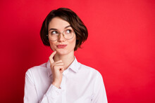 Photo Portrait Of Curious Business Woman Wearing Spectacles Formal Wear Smiling Looking Copyspace Isolated Bright Red Color Background