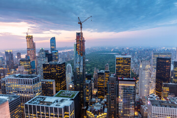 Fototapete - New York City skyline with urban skyscrapers at sunset, USA.