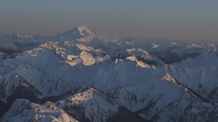 Wall Mural - 4k aerial dramatic mountains winter sunset