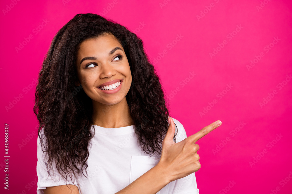 Portrait of attractive cheerful girl demonstrating copy space like ...