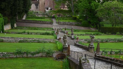 Wall Mural - historic staircase in the middle of a lawn in the Bardini garden in Florence in a spring day. Italy