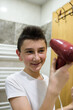 © Minet - Boy dries hair the hair dryer.