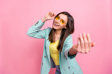 Wall Mural - Photo portrait of cool funky girl calling you to follow isolated on pastel pink colored background