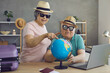 Leinwandbild Motiv Happy excited retired senior couple planning holiday trip together. Cheerful old people in hats and sunglasses choosing their dream destination on Earth globe. Traveling and active vacation concept
