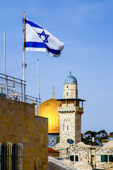 Wall Mural - Jerusalem, Israel - 21 April 2021: flag of Israel, Minaret and Dome of the Rock on a sunny day