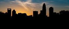The Charlotte NC Skyline Silhouetted Against The Vibrant Sky At Sunset