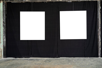 Two white picture frames were hung in a gallery