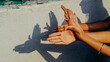 © 100cameras - Pair of hands creating shadow puppet in sunshine