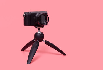 digital photo camera on small tripod