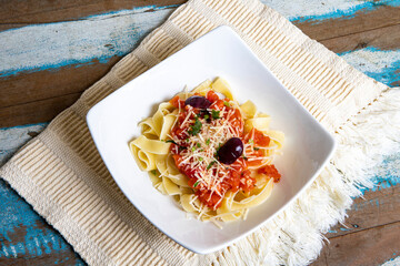 Fettuccine pasta with fresh homemade tomato sauce and parsley