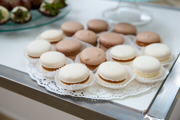 Rows of delicious desserts in beautiful compositions. Sweets on the banquet table - a photo taken during catering. Copyspace.