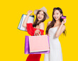 © Tom Wang - happy young women dressed in summer clothes holding shopping bags and credit cards