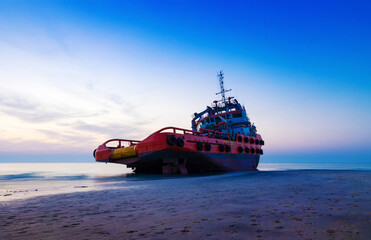 Ship Wreck along the Umm Al Quwain Coast in UAE. A stranded or abandoned vessel on the beach. Long Exposure Shot.