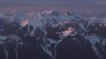 Wall Mural - 4k aerial dramatic mountains winter sunset