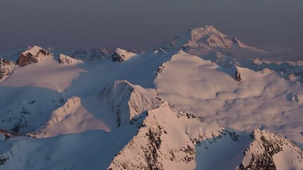 Wall Mural - 4k aerial dramatic mountains winter sunset