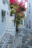 Fototapeta Uliczki - Narrow street of the old town with, Lefkes, Paros Island, Greece.