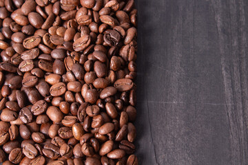 Poster - Top view of roasted coffee beans on a wooden table