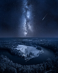 Wall Mural - milky way over river and forest. wildlife at night.