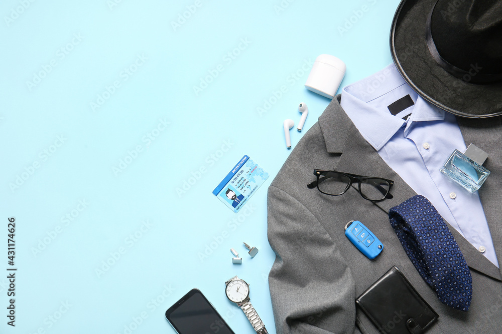 Stylish male clothes and accessories on color background