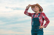 © Bits and Splits - Portrait of concerned female farmer agronomist outdoors