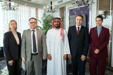 Poster - A group of people standing in boardroom while posing for a photo