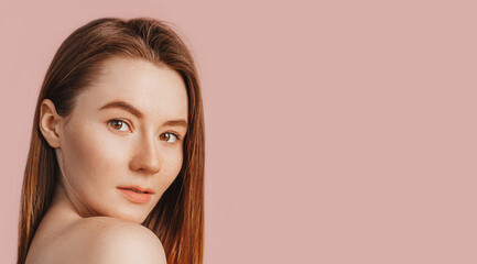 Wall Mural - beautiful sensual young girl with clean skin on a pink background with a mockup. topless woman. the 