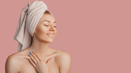Wall Mural - beautiful sensual young girl with clean skin on a pink background with a mockup. topless woman in a 