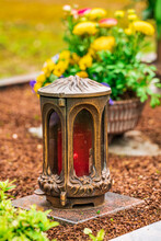 Damaged Grave Light With  Candle On A Grave