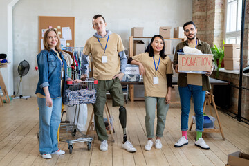 Sticker - A group of people with donation clothes standing in office