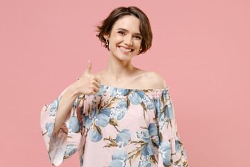 Wall Mural - Young smiling happy stylish satisfied caucasian woman 20s with short hairdo wear trendy blouse show thumb up like gesture isolated on pastel pink background studio portrait. People lifestyle concept