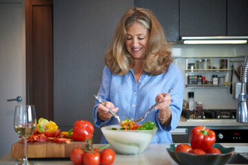 Wall Mural - Senior Woman Preparing Salad