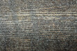 Wooden weathered gray plank board background close-up overhead with light snow wooden texture