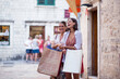© Novak - Smiling girl with shopping bags in old town