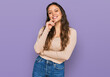 © Krakenimages.com - Young hispanic girl wearing casual clothes looking confident at the camera with smile with crossed arms and hand raised on chin. thinking positive.