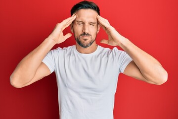 Wall Mural - Young handsome man wearing casual white tshirt with hand on head, headache because stress. suffering migraine.