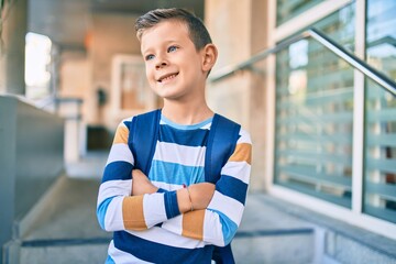 Poster - Adorable caucasian student boy smiling happy standing at the city.