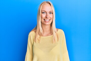 Poster - Young blonde girl wearing casual clothes with a happy and cool smile on face. lucky person.