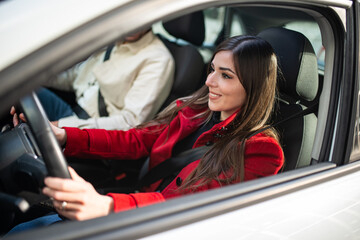 Young woman driving her car