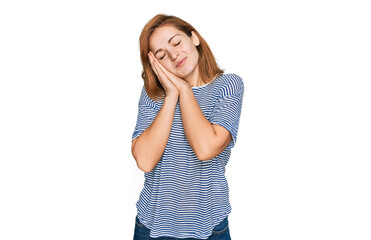 Young caucasian woman wearing casual clothes sleeping tired dreaming and posing with hands together while smiling with closed eyes.