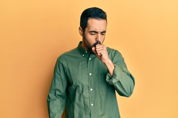 Wall Mural - Young hispanic man wearing casual clothes feeling unwell and coughing as symptom for cold or bronchitis. health care concept.