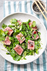 Wall Mural - Japanese sliced grilled tuna steak salad with sesame and suace. Close up