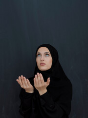 Wall Mural - Portrait of young Muslim woman making dua