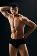 © SHOTPRIME STUDIO - handsome man with muscled naked body in dark panties cropped view studio