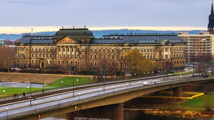 Wall Mural - Dresden, Germany. Aerial view of old historical building and car traffic at the bridge. Time-lapse during a cloudy winter day, panning video