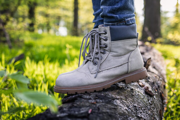 Wall Mural - hiking boot. closeup leather sport shoes in forest