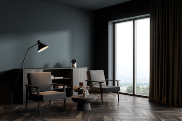 Dark living room interior with armchairs on parquet floor near window